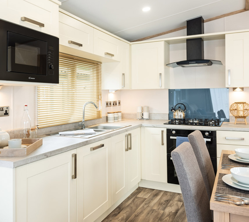 White kitchen with wood blinds